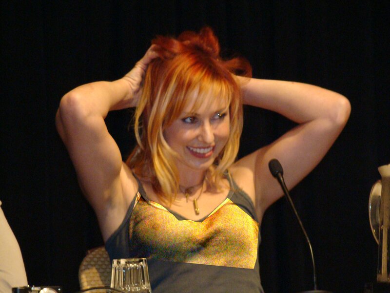 woman with red hair at panel
