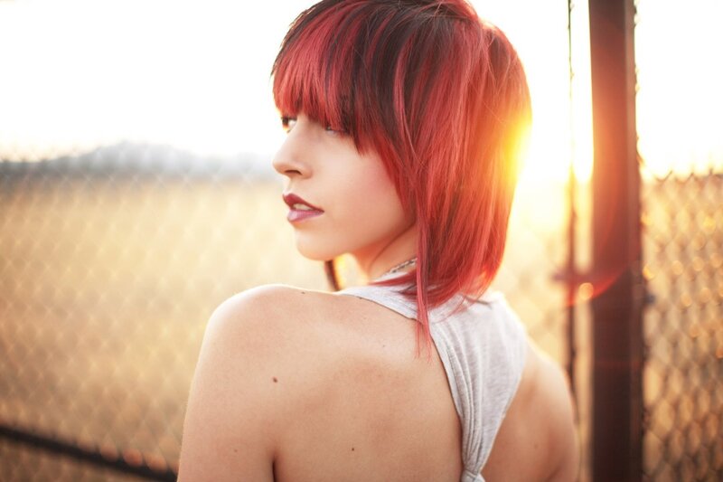 woman with red hair at sunset