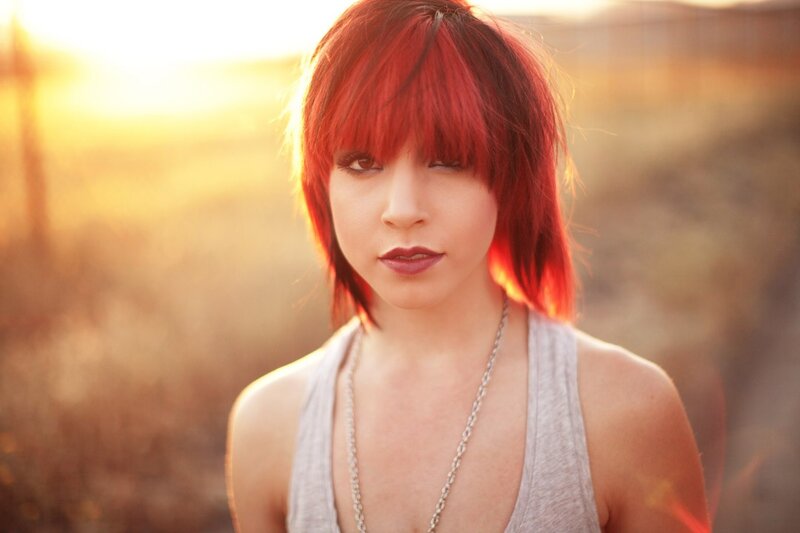 woman with red hair at sunset
