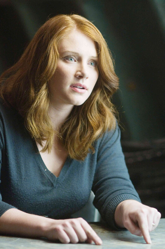 woman with red hair at table