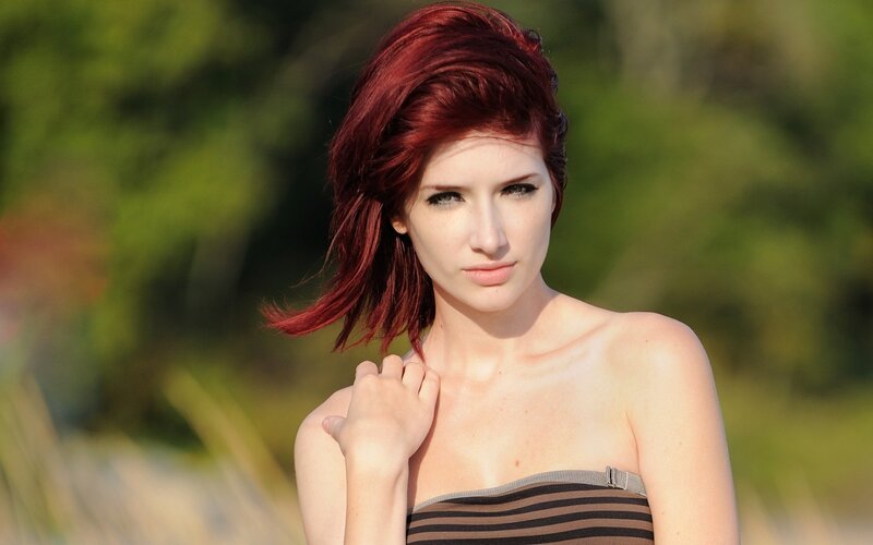 Woman with Red Hair — Calm, Afternoon, Photograph, Striped Top, Green Foliage
