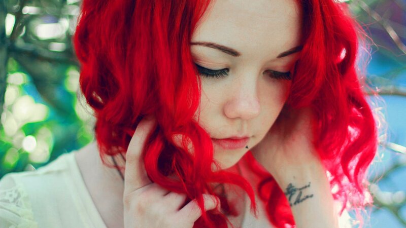 Woman with Red Hair — Contemplative, Afternoon, Photograph, Tattoo, Piercing