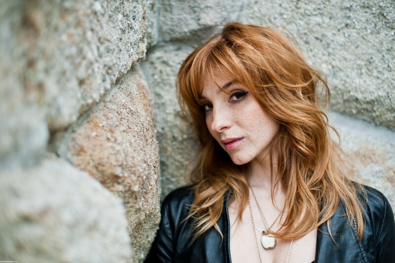 Woman with Red Hair — Contemplative, Photograph, Stone Wall