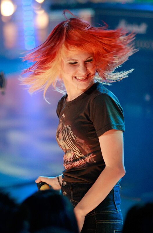 woman with red hair dancing