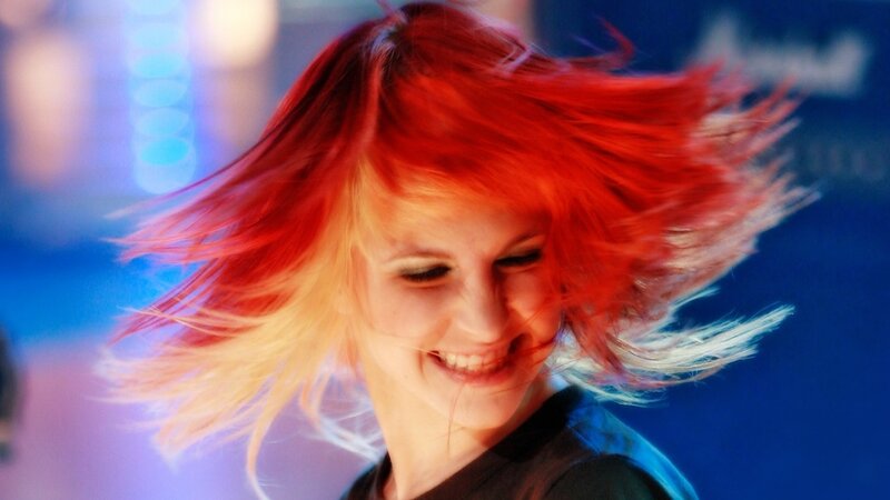 woman with red hair dancing