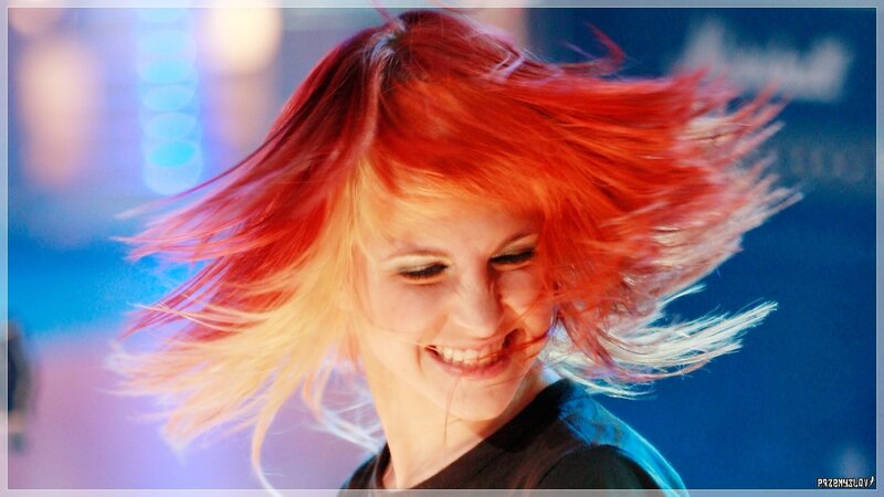 woman with red hair dancing
