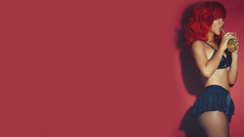 woman with red hair drinking