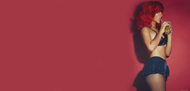 woman with red hair drinking