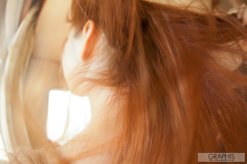 woman with red hair from behind