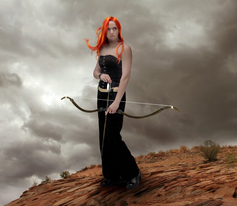 Woman with Red Hair Holding Bow