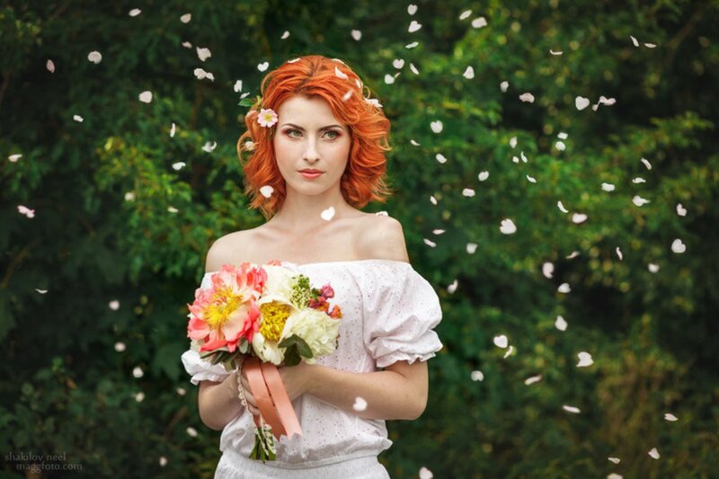 Woman with Red Hair Holding Flowers — Serene