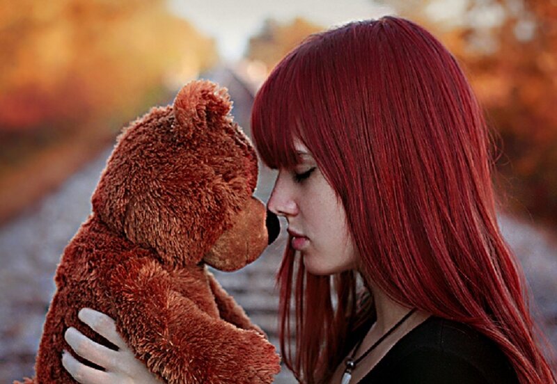 Woman with Red Hair Holding Teddy Bear — Calm