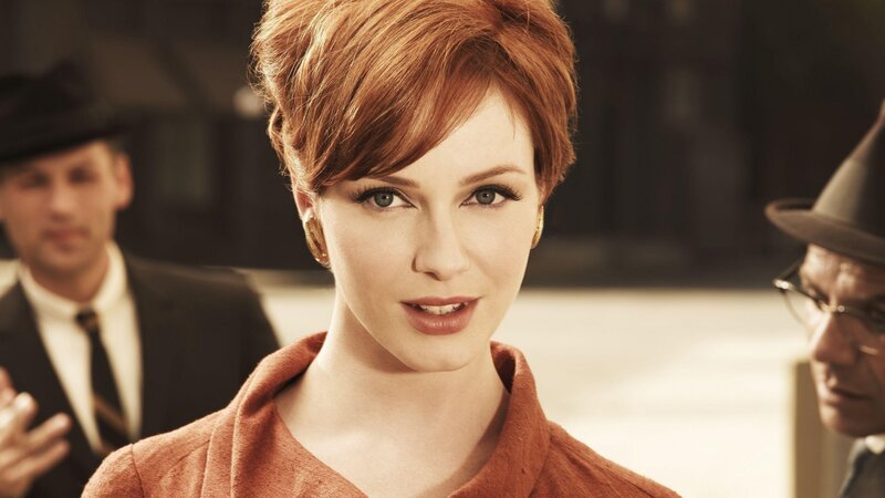 woman with red hair in a crowd