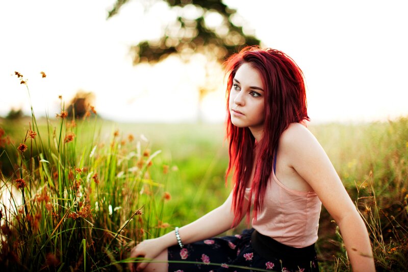 woman with red hair in a field