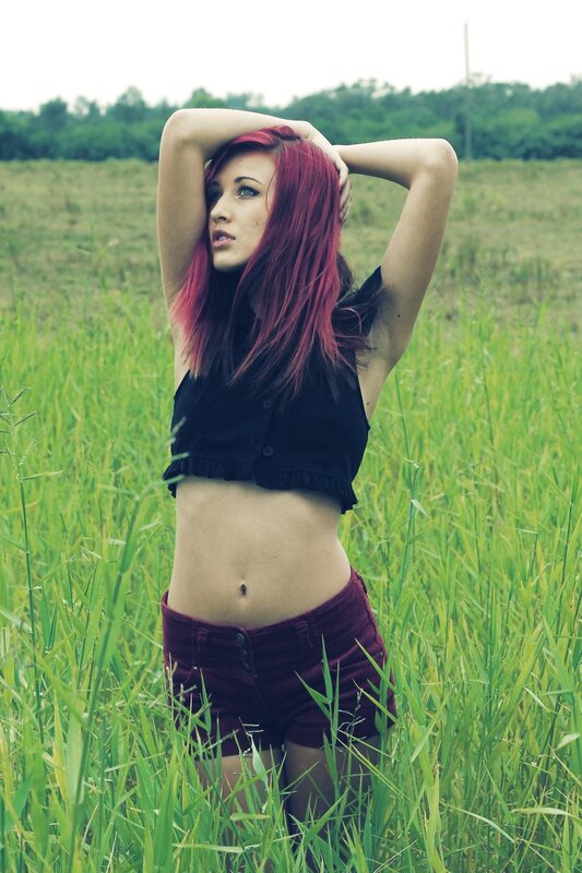 woman with red hair in a field