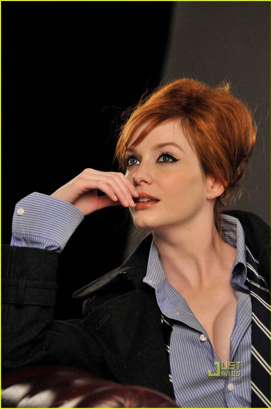 woman with red hair in a striped shirt