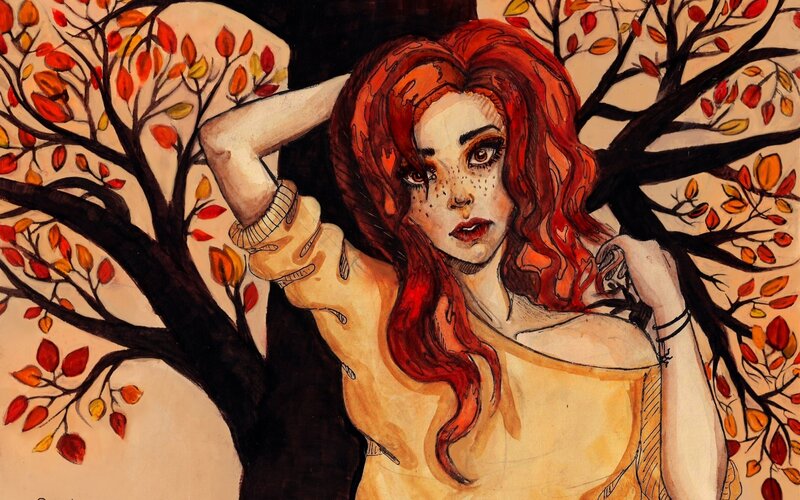 woman with red hair in autumn