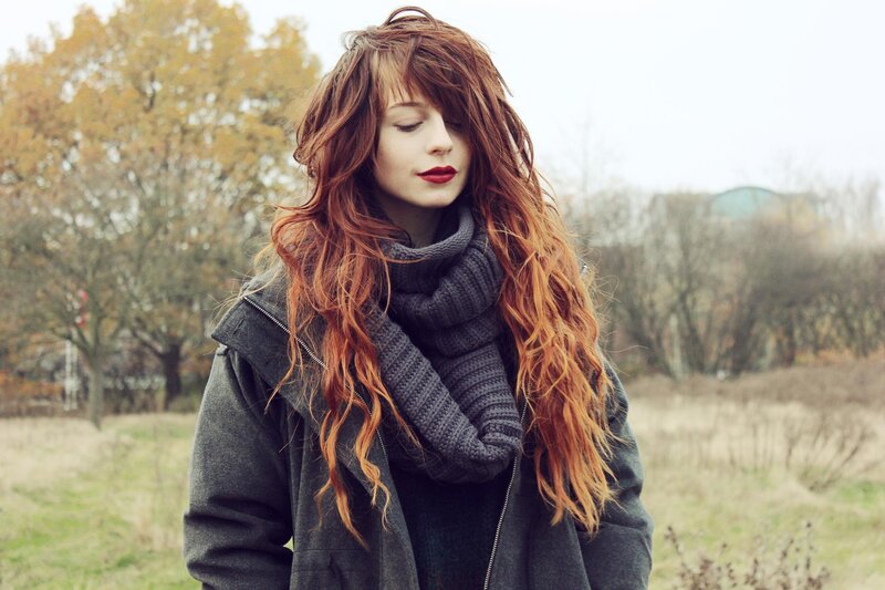 woman with red hair in autumn
