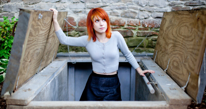 Woman with red hair in basement