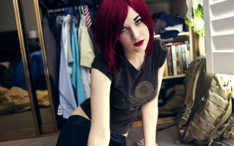 woman with red hair in bedroom