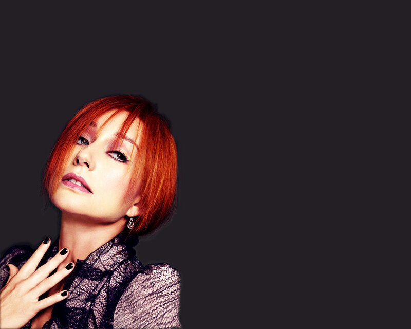 woman with red hair in black lace