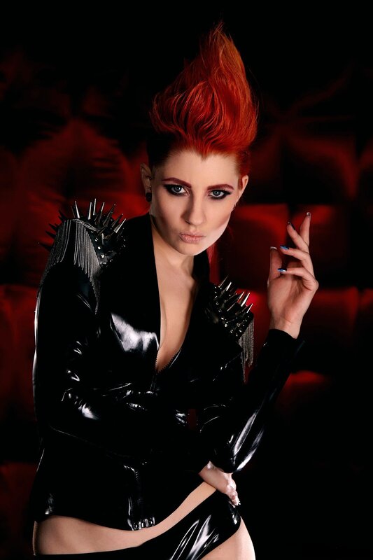 woman with red hair in black outfit