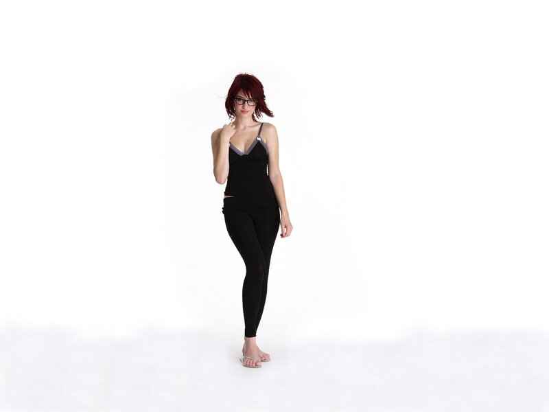 woman with red hair in black outfit