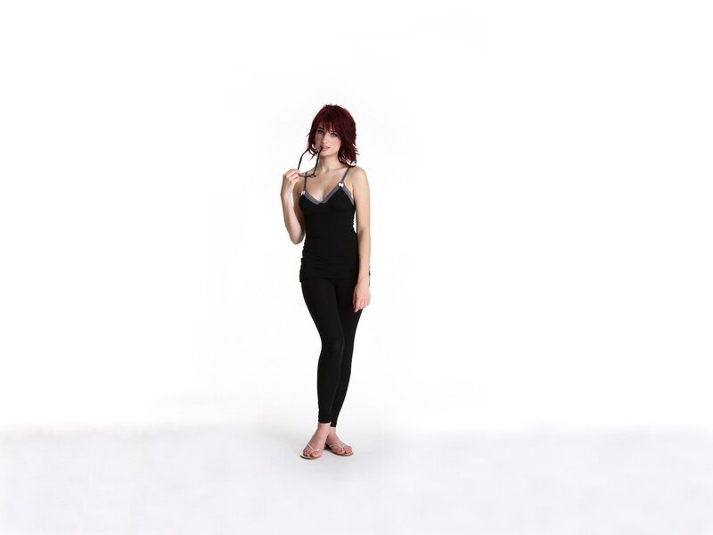woman with red hair in black outfit
