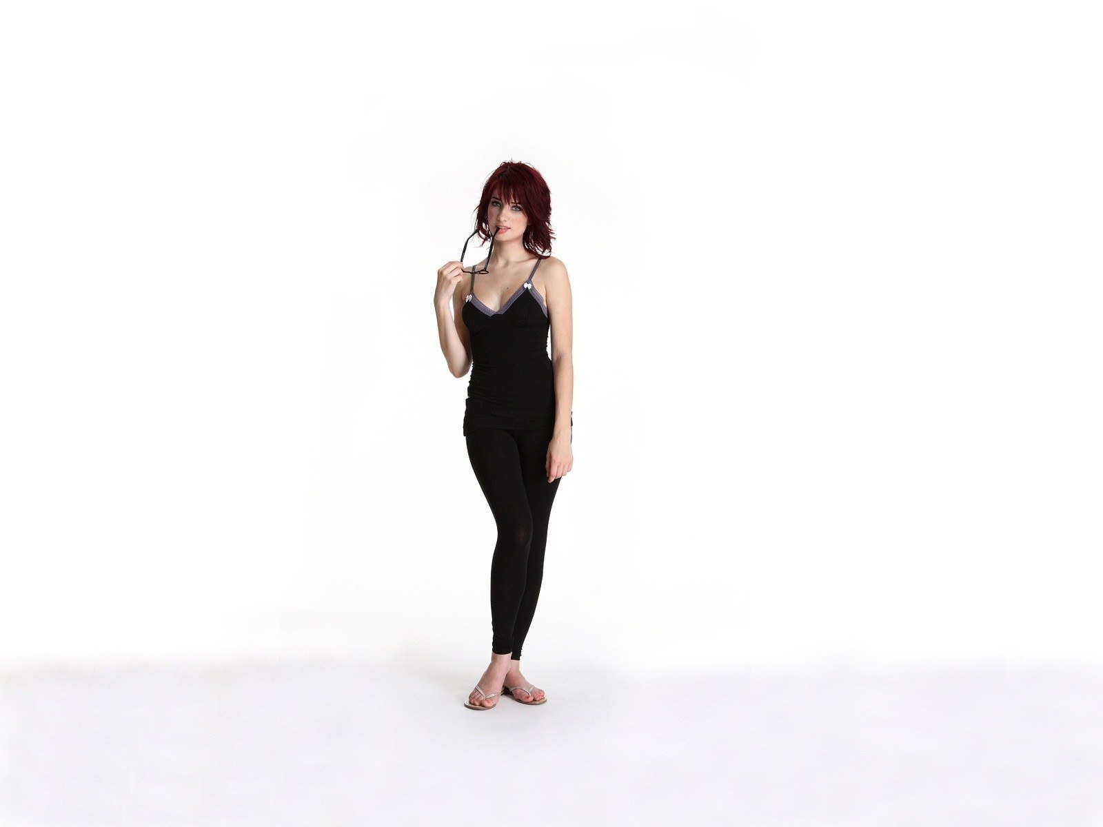 woman with red hair in black outfit