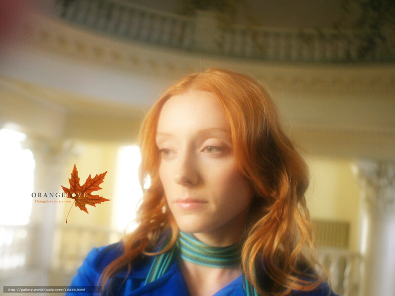 woman with red hair in blue coat