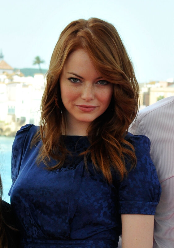 woman with red hair in blue dress