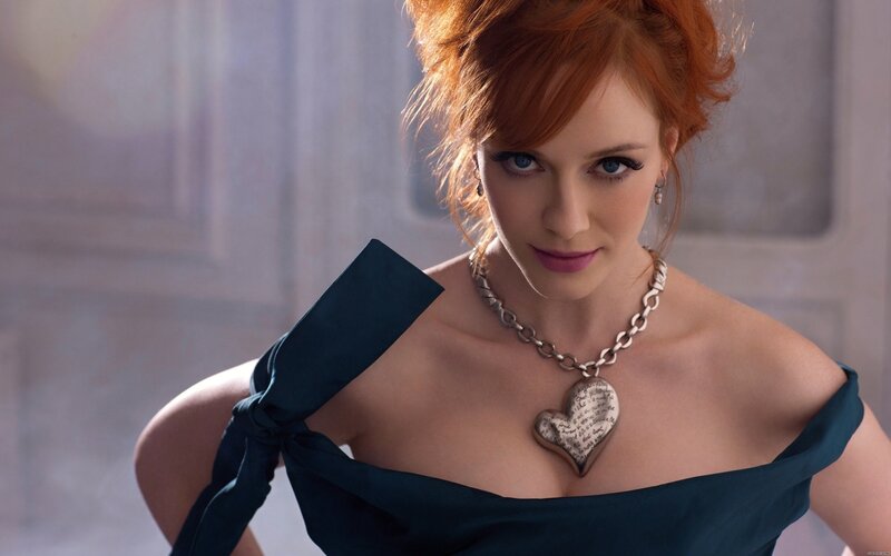 woman with red hair in blue dress