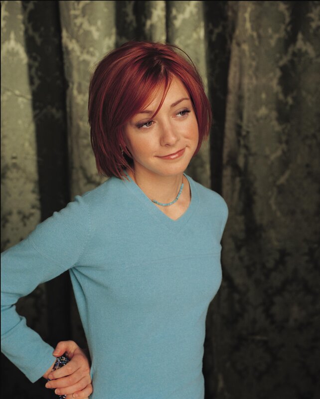 woman with red hair in blue sweater