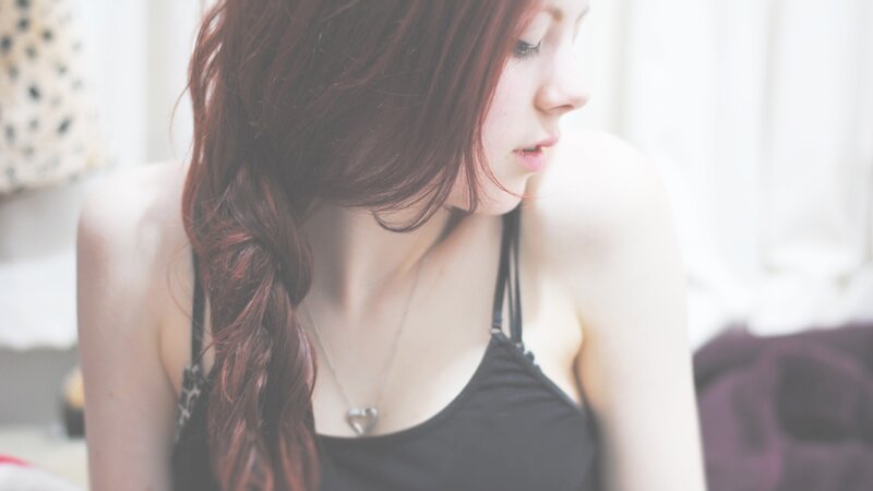 woman with red hair in braid