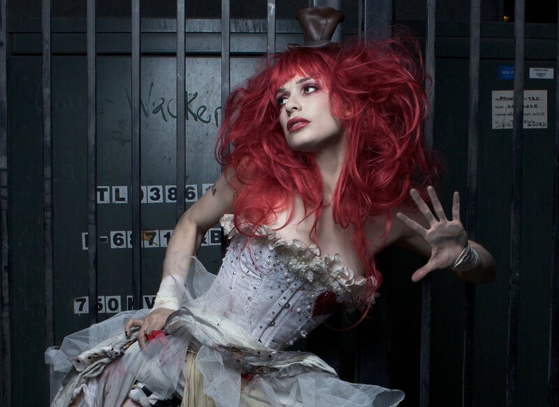 Woman with Red Hair in Cage — Dramatic