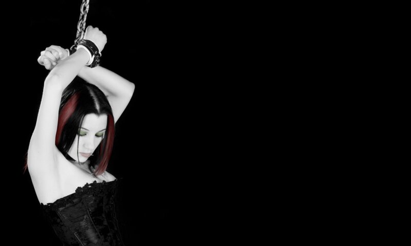 woman with red hair in chains