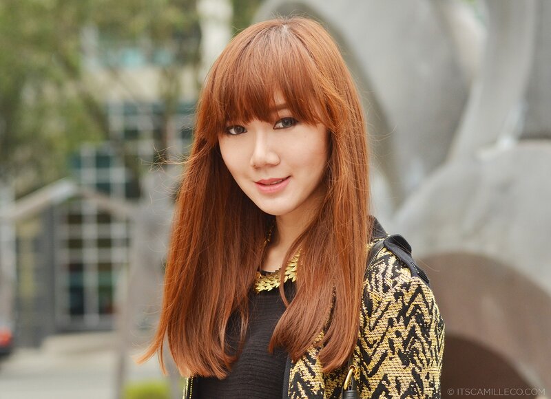woman with red hair in city