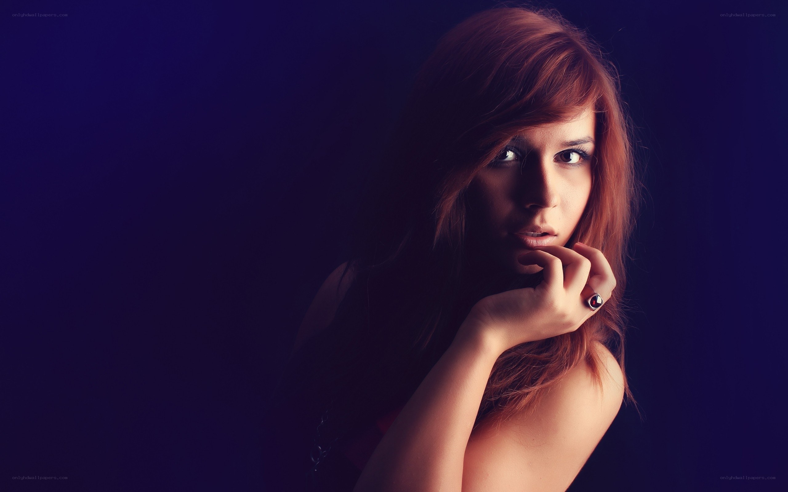 woman with red hair in dark setting