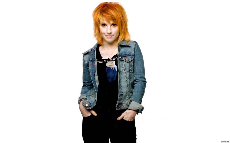 woman with red hair in denim jacket