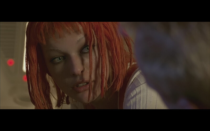 woman with red hair in dim light