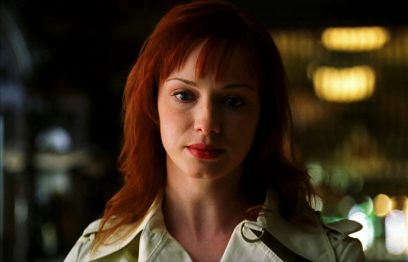 woman with red hair in dim light