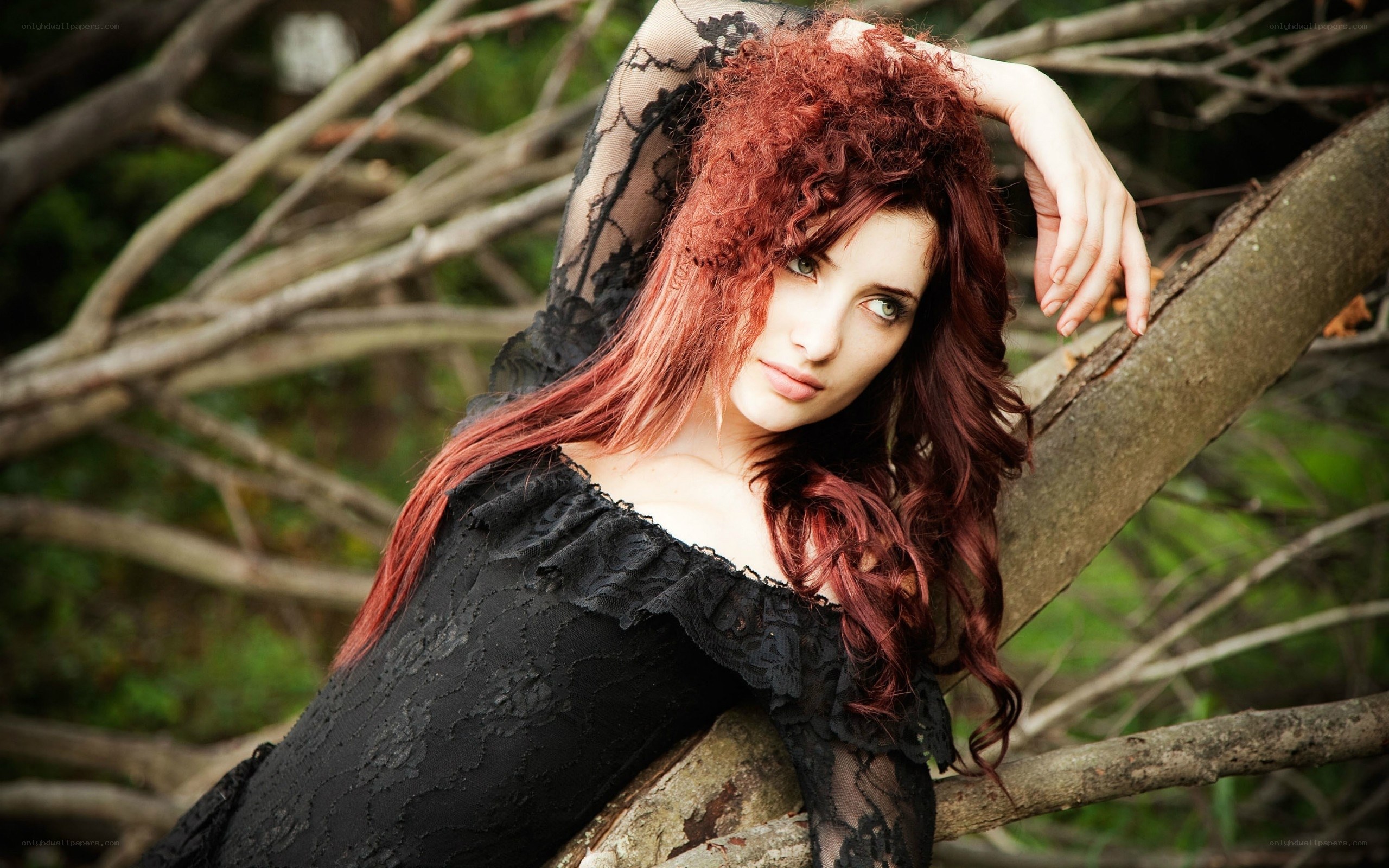 woman with red hair in forest