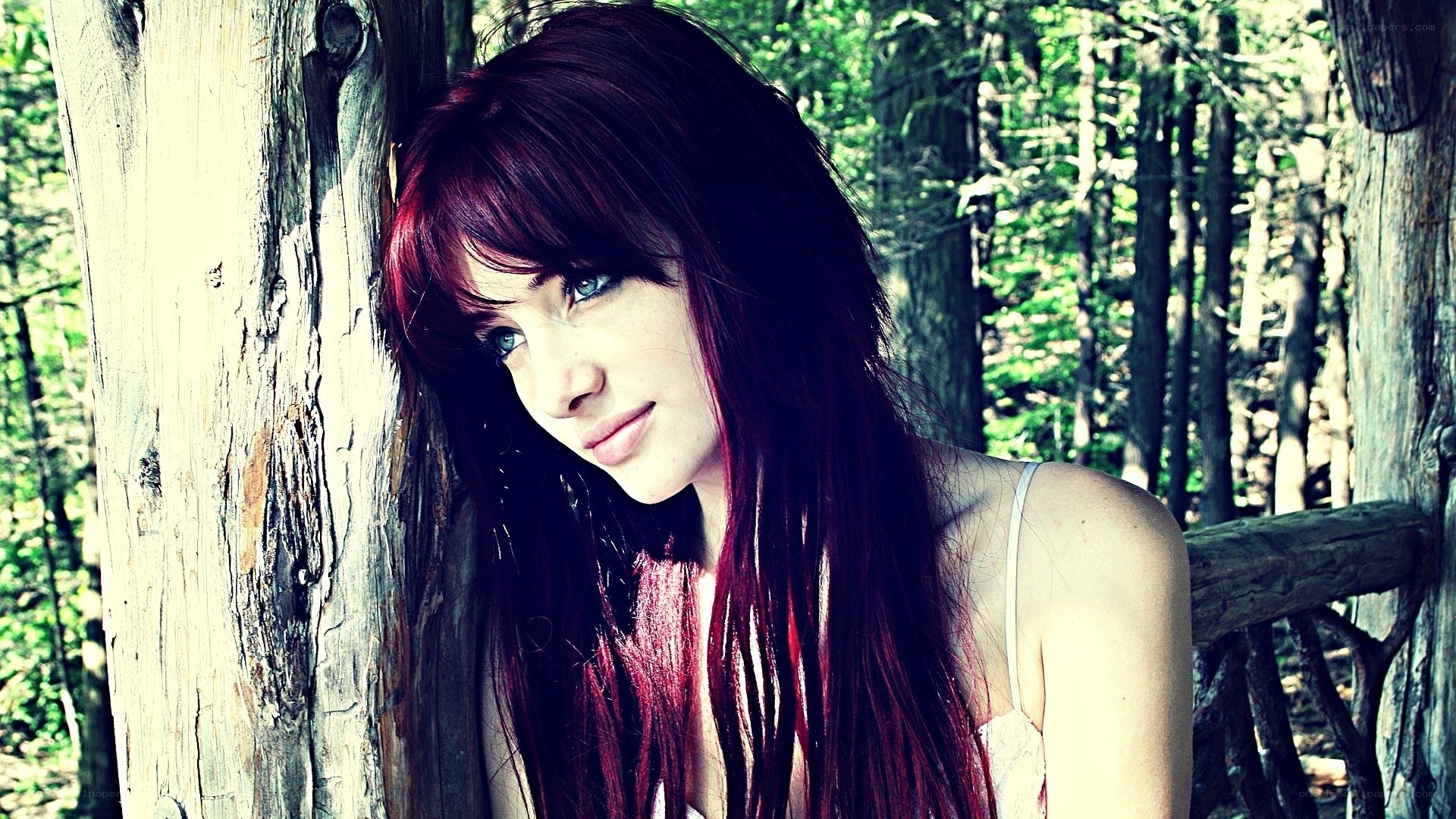 woman with red hair in forest