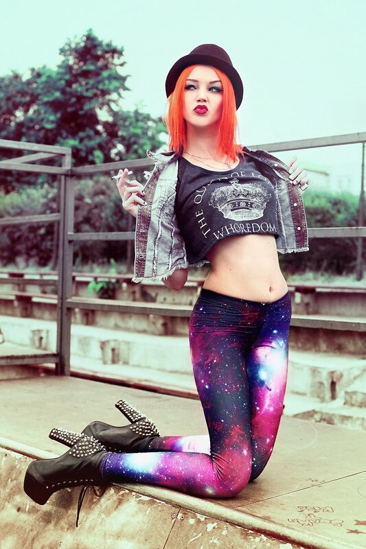 woman with red hair in galaxy leggings