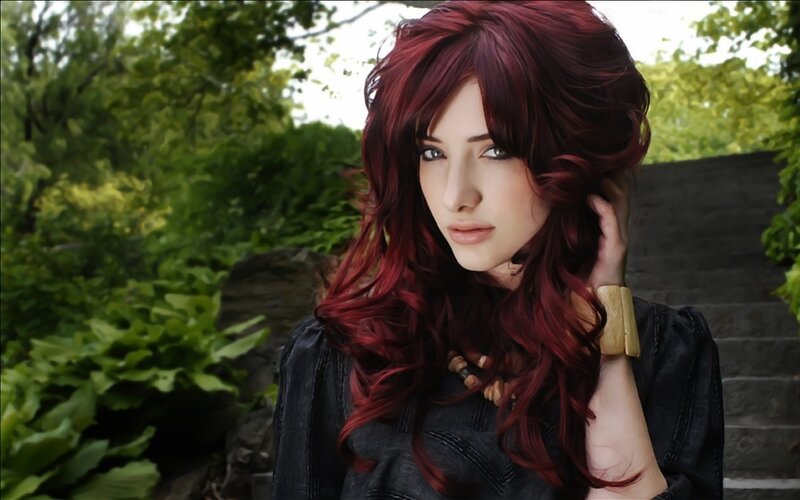woman with red hair in garden