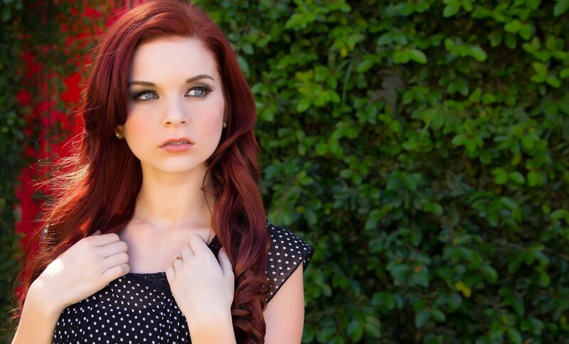 woman with red hair in garden