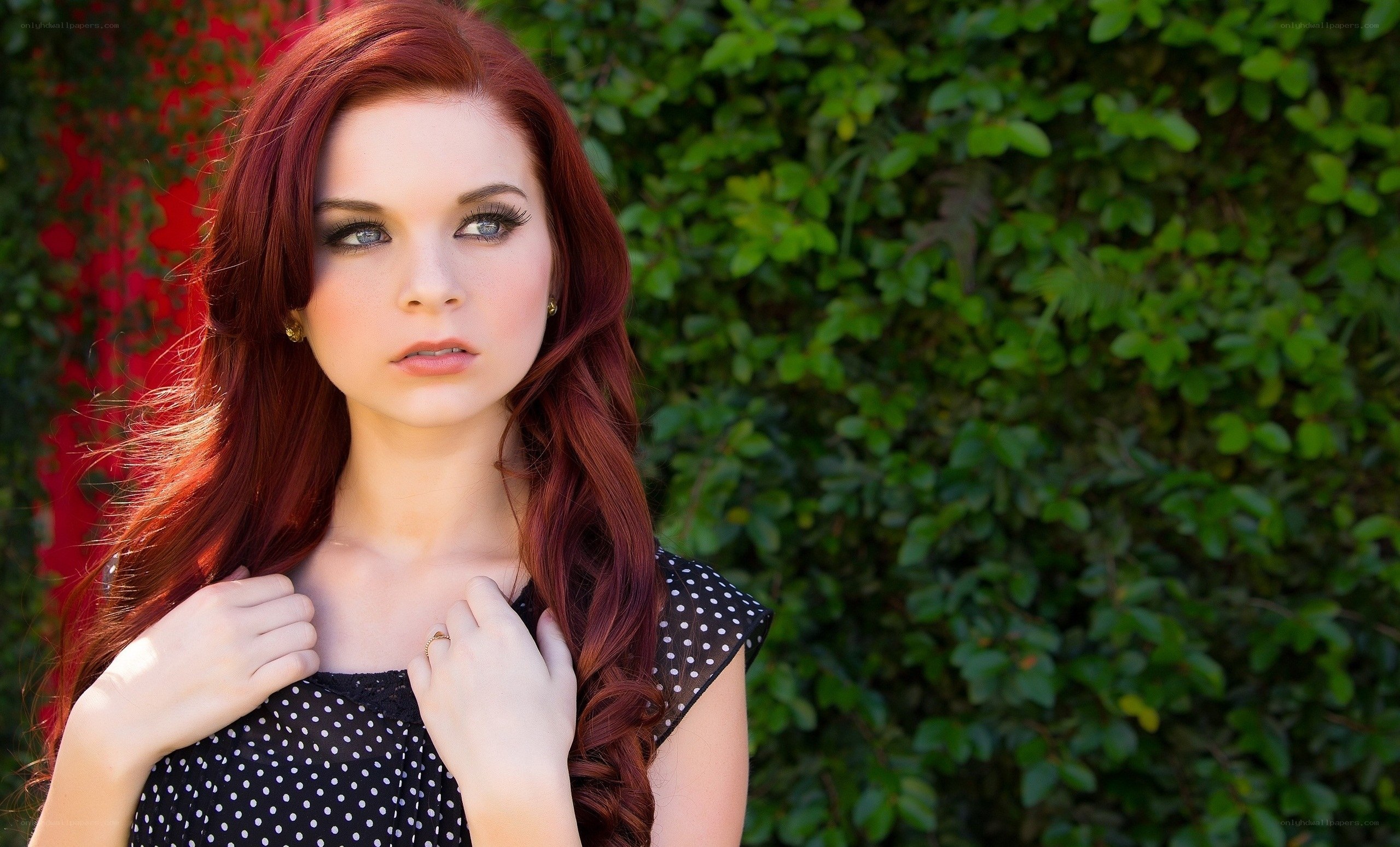 woman with red hair in garden