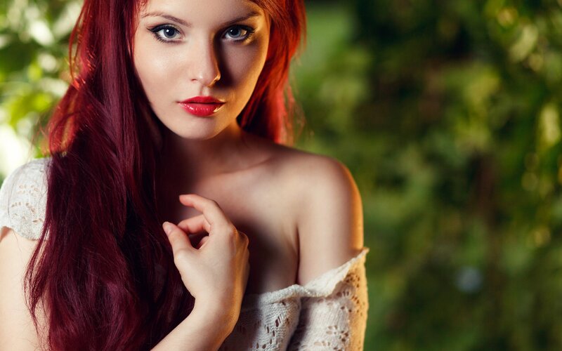 woman with red hair in garden