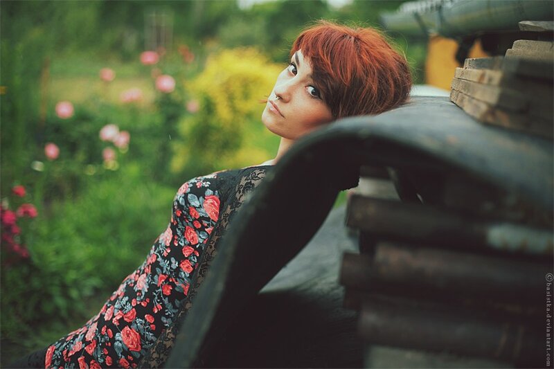 woman with red hair in garden