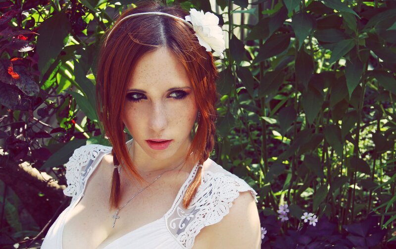 woman with red hair in garden